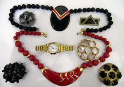 Quantity of costume jewellery to include beaded necklaces, bangles, brooches,