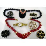 Quantity of costume jewellery to include beaded necklaces, bangles, brooches,