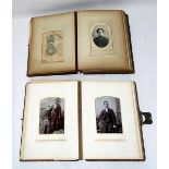 Two Victorian photograph albums containing portrait photographs and several postcards