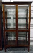 Mahogany display cabinet, the glazed panel doors, sides and back enclosing glass shelves,