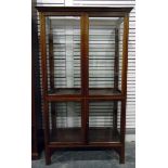 Mahogany display cabinet, the glazed panel doors, sides and back enclosing glass shelves,