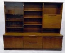 Modern teak unit comprising of glazed bookcase, open shelves,