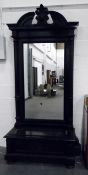 19th century continental ebonised wood Pier mirror with cabinet to base, on bun feet,