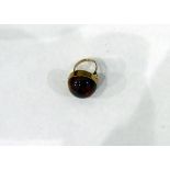Gold-coloured and amber cabochon mounted ring (shank unmarked),
