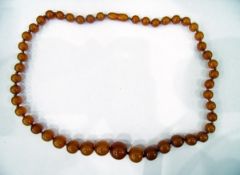 Amber graduated beaded necklace, circular beads,