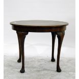 Circular mahogany tea table on four cabriole supports with pad feet,