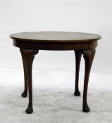 Circular mahogany tea table on four cabriole supports with pad feet,