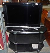 Sanyo 26" flatscreen television with remote control and black glass television stand including