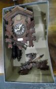 Cuckoo clock and another clock