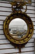 American style circular gilt wall mirror with eagle to surmount, ball decoration to mirror, 44.