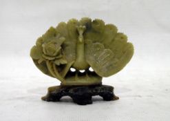 Carved jade model of a peacock with flower, on pierced base,