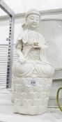 Oriental blanc de chine figure of a Buddha seated on lotus plants,