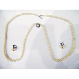 Cultured pearl graduated necklace on silver clasp and a pair of earrings
