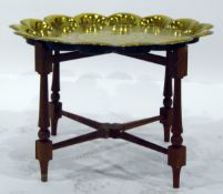 Engraved brass top occasional table with petal-shaped rim,
