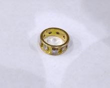 Gold coloured metal & diamond ring, set with 9 diamonds,