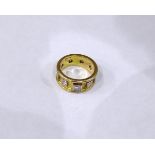 Gold coloured metal & diamond ring, set with 9 diamonds,