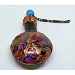 19th century scent bottle with circular turquoise stopper, gold, pink and blue swirl glass to body,