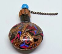 19th century scent bottle with circular turquoise stopper, gold, pink and blue swirl glass to body,