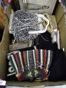 Various vintage evening bags including tapestry, lace, beaded and later bags, a black cobweb shawl,