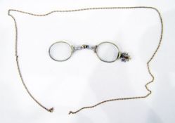 Pair of gold-coloured fold-out spectacles and a gold-coloured chain in a leather case