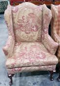 Revived Georgian style wing armchair with camel back top,