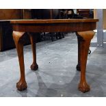 Reproduction circular side table on four cabriole supports with claw and ball feet