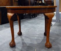 Reproduction circular side table on four cabriole supports with claw and ball feet