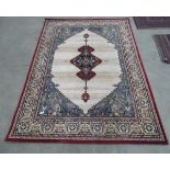 Medium sized Eastern style rug, dark maroon border with cream and blue design,