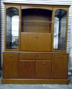 Modern Morris Furniture Group display unit with pair of glazed cupboards above single drawer,