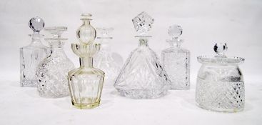 Six cut glass and moulded glass decanters of various designs and a cut glass biscuit barrel (7)