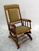 Victorian platform rocking armchair with padded back, seat and arms,