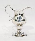 George III silver pedestal cream jug, having repousse beaded rim, shaped scroll handle,