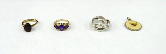 9ct gold and amethyst set ring, a 9ct gold and garnet set ring,