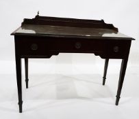 Edwardian mahogany dressing table with plate glass top, three frieze drawers,