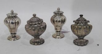 Two pairs of Indian colonial silver pepperettes, each of baluster ribbed form,