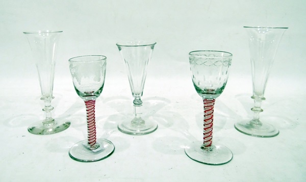 Two 19th century cordial glasses with cranberry and opaque white cotton-twist stems,