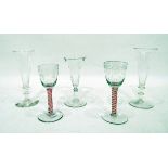 Two 19th century cordial glasses with cranberry and opaque white cotton-twist stems,