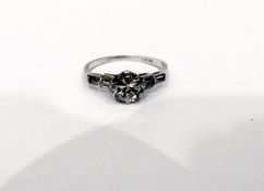 Platinum and diamond ring, the central circular solitaire diamond 7mm in diameter approx (chipped),