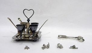 Silver plated egg cup stand fitted four egg cups and associated spoons,