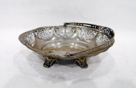 Early 20th century silver oval handled basket, pierced decoration, on scroll feet, Walker & Hall,