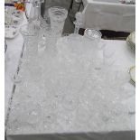 Large quantity of assorted cut glass including a claret jug/decanter, vases, wines, tumblers,