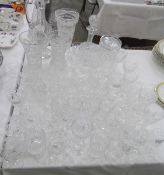 Large quantity of assorted cut glass including a claret jug/decanter, vases, wines, tumblers,