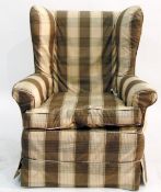 Wingback armchair upholstered in brown and cream check cover