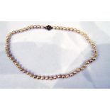 Single strand of uniform cultured pearls with a 9ct gold ropetwist clasp and a second single row of