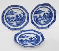 Set of three Chinese blue and white octagonal-shaped dishes decorated with pagodas in a landscape,