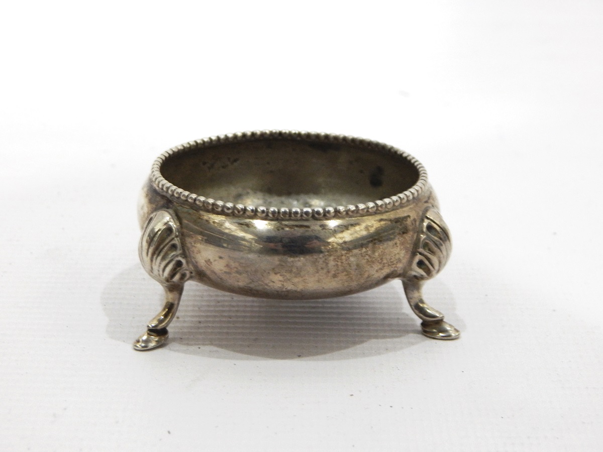 Silver circular salt with beaded rim on splayed feet, London,