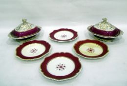 Set of four 19th century plates decorated with a flower motif within a burgundy and gold rim and a