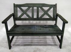 Painted garden seat with cross latticework open back and slatted seat,