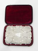 Victorian silver card case of shaped rectangular form, with engraved and engine-turned decoration,