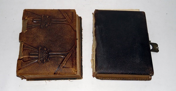 Two Victorian photograph albums containing portrait photographs and several postcards